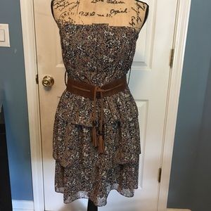 Floral dress with brown belt included.